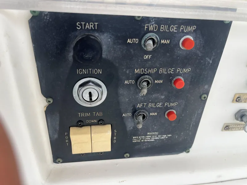 Slide: The Image of Control panel of 1985 Hatteras 45 Convertible boat with ignition and bilge pump switches. - 23