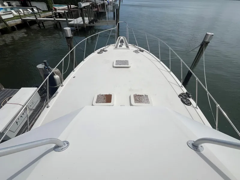 Slide: The Image of 1985 Hatteras 45 Convertible yacht deck view at marina. - 24