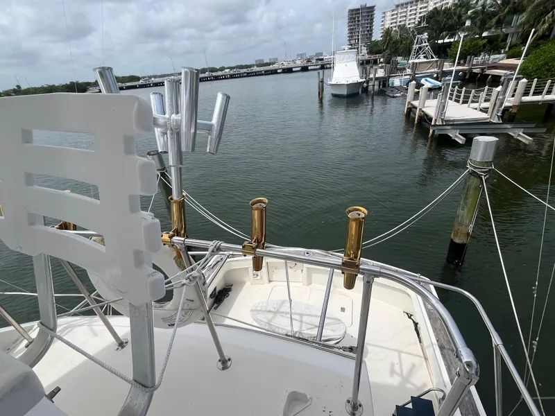 Slide: The Image of 1985 Hatteras 45 Convertible yacht docked in a marina, view from the deck. - 29