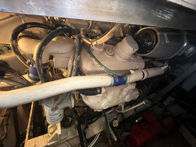 Slide: The Image of Engine compartment of a 1985 Hatteras 45 Convertible boat, showcasing mechanical components. - 39