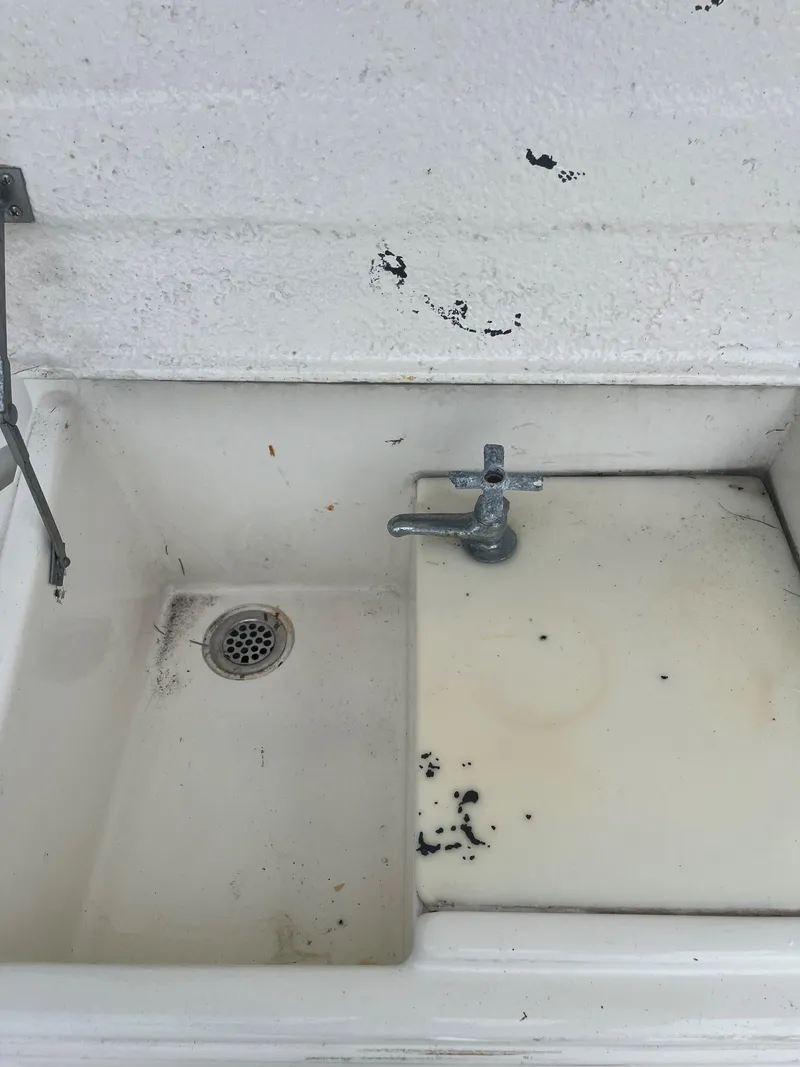 Slide: The Image of Old sink with faucet, stained surface, aboard 1985 Hatteras 45 Convertible boat. - 49