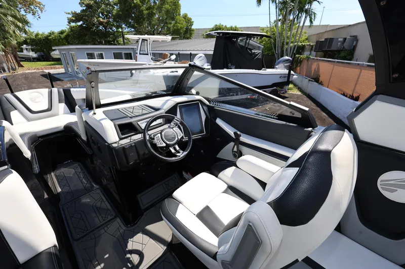 Slide: The Image of Interior of 2021 Tigé 23ZX boat with modern dashboard and seating. - 11