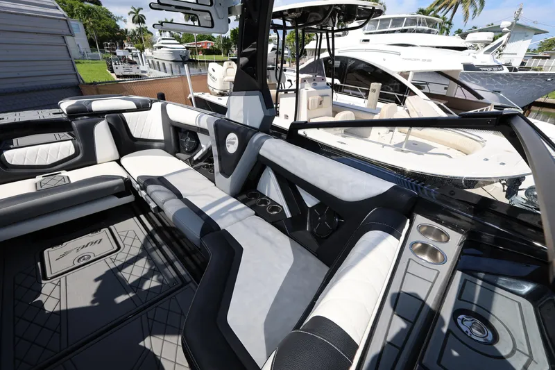 Slide: The Image of 2021 Tigé 23ZX boat interior with luxurious seating and modern design. - 15