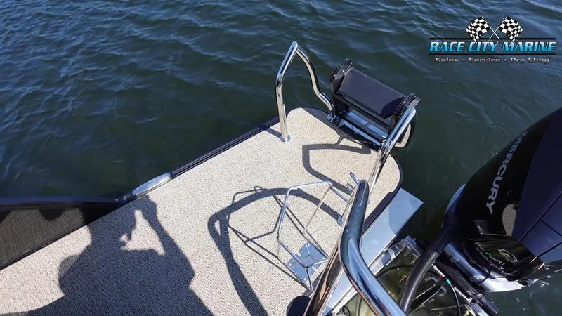 Slide: The Image of 2025 Barletta L23U boat deck with ladder and Mercury engine on water. - 10