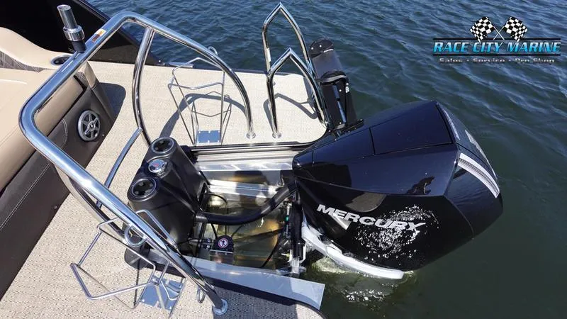 Slide: The Image of 2025 Barletta L23U boat with Mercury outboard motor at dockside. - 11