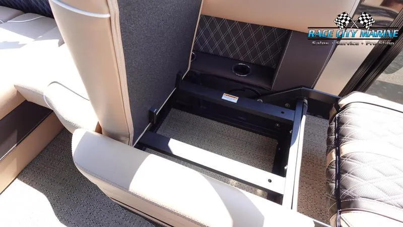 Slide: The Image of 2025 Barletta L23U boat interior with open storage compartment and cushioned seating. - 21