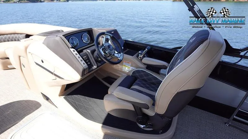 Slide: The Image of 2025 Barletta L23U boat interior with steering wheel and dashboard, Race City Marine logo. - 27