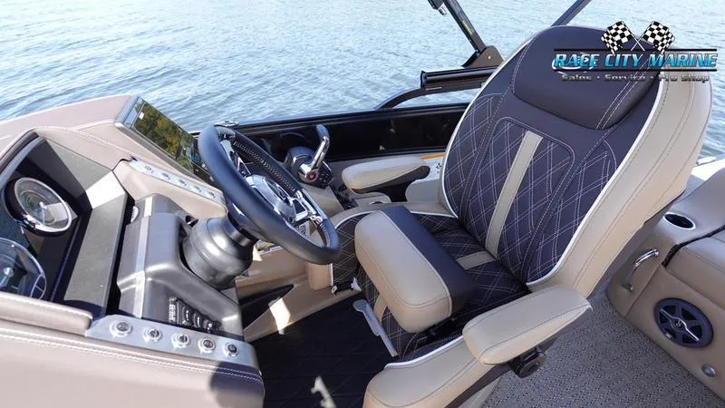 Slide: The Image of 2025 Barletta L23U boat interior with modern steering and comfortable seating. - 28