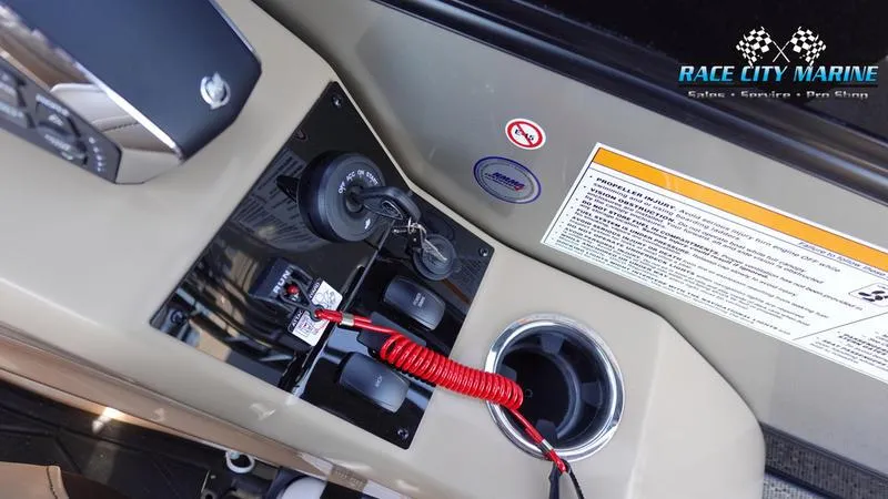 Slide: The Image of Control panel of 2025 Barletta L23U boat with ignition keys and safety features. - 29