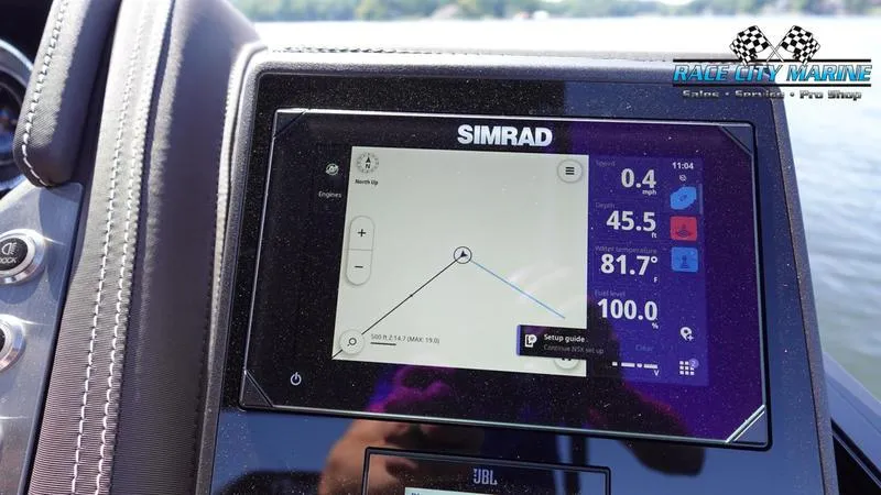 Slide: The Image of Simrad navigation display on 2025 Barletta L23U boat dashboard, showing speed and temperature. - 34