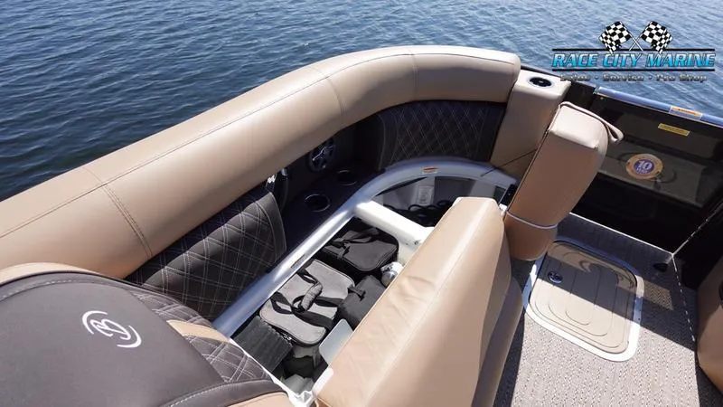 Slide: The Image of 2025 Barletta L23U pontoon boat interior with tan seating and storage compartments. - 44