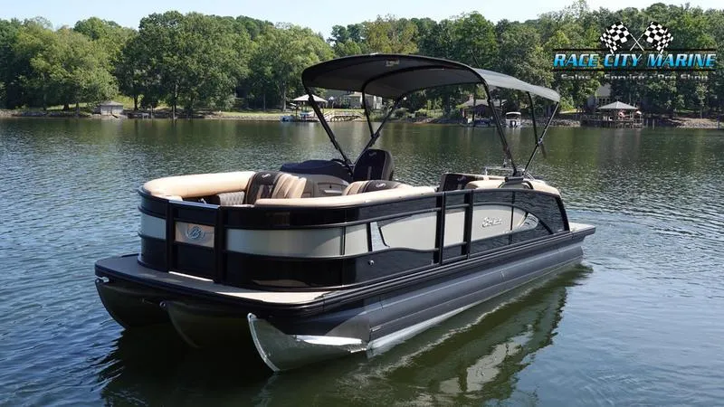 Slide: The Image of 2025 Barletta L23U pontoon boat on a serene lake. - 6