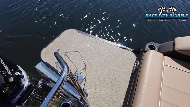 Slide: The Image of 2025 Barletta L23U boat deck with Race City Marine logo, on sparkling water. - 9