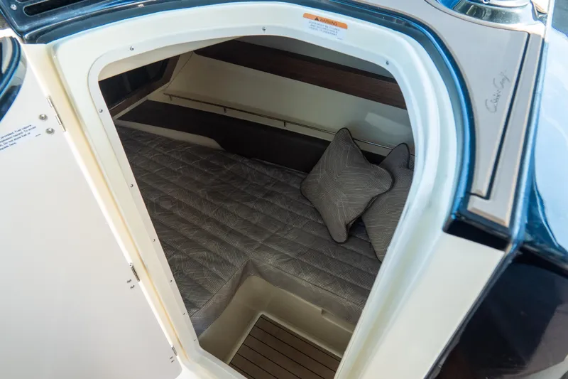 Slide: The Image of 2026 Chris-Craft Calypso 35 cabin interior with cozy bedding and pillows. - 17