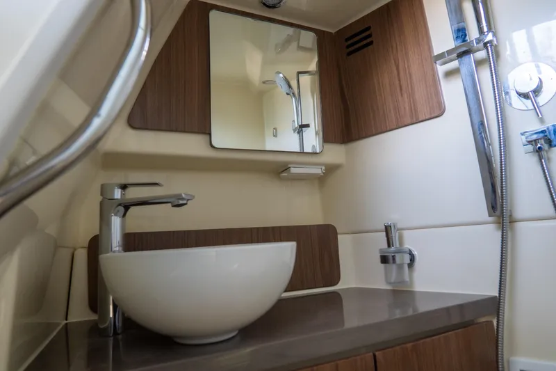 Slide: The Image of Modern bathroom interior of 2026 Chris-Craft Calypso 35 yacht, featuring sleek sink and fixtures. - 22