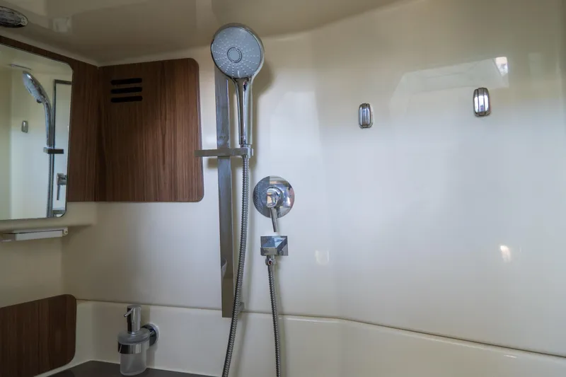 Slide: The Image of Luxurious bathroom interior of 2026 Chris-Craft Calypso 35 yacht with modern shower fixtures. - 23