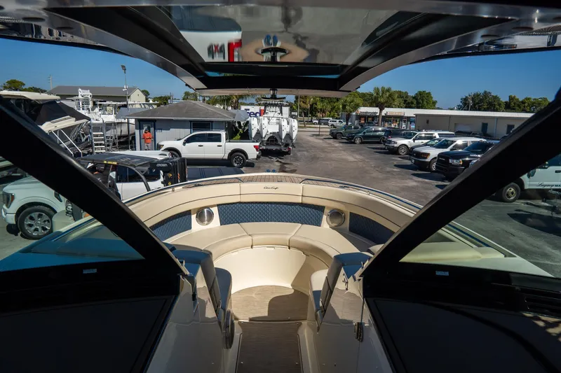Slide: The Image of 2026 Chris-Craft Calypso 35 boat interior view at a marina. - 25