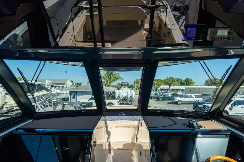 Slide: The Image of Interior view of 2026 Chris-Craft Calypso 35 boat, showcasing cockpit and dashboard. - 33