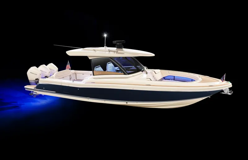 Slide: The Image of 2025 Chris-Craft Calypso 35 boat with sleek design and blue hull lighting. - 36