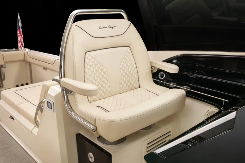 Slide: The Image of 2026 Chris-Craft Calypso 35 cockpit with dual consoles and wooden steering wheel. - 9
