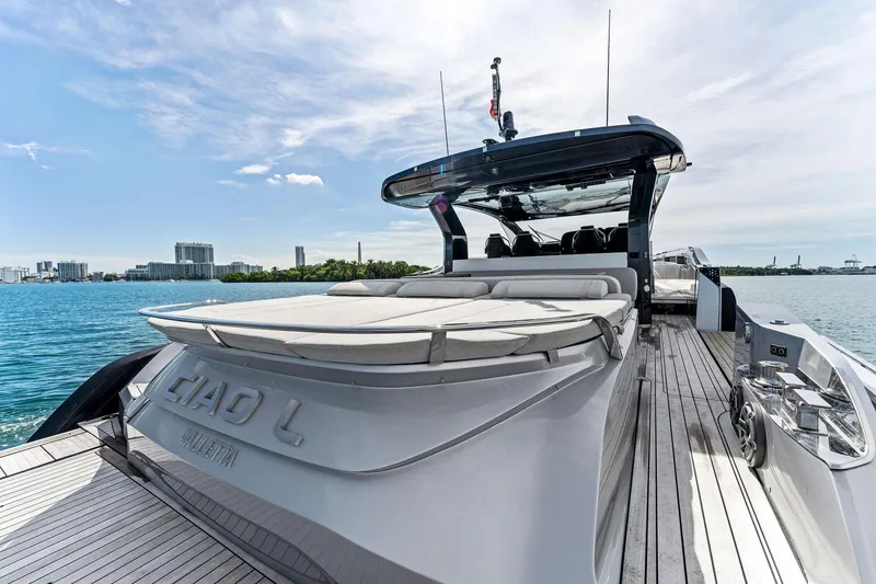 Slide: The Image of Luxury 2022 SACS Rebel 55 yacht on water with city skyline in background. - 41
