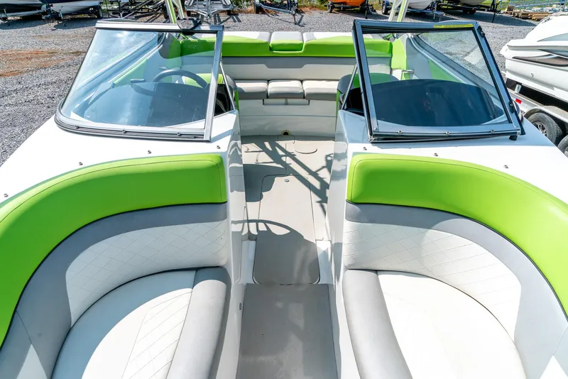 Slide: The Image of 2014 Rinker Captiva 200 MTX boat interior with green and white seating. - 17
