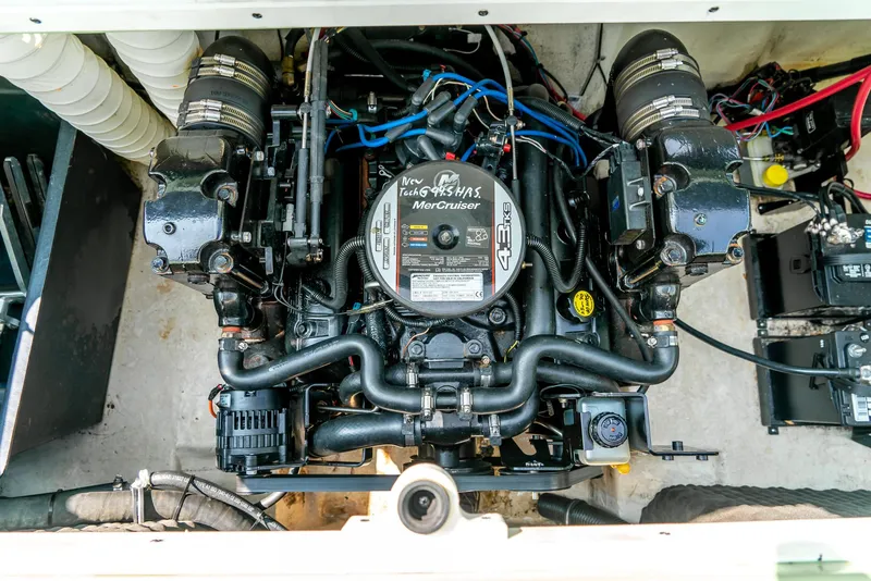 Slide: The Image of Engine compartment of a 2014 Rinker Captiva 200 MTX boat, featuring a MerCruiser engine. - 20
