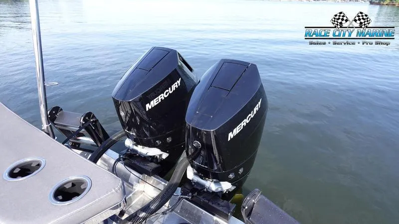 Slide: The Image of Barletta L25UCAT 2025 with dual Mercury outboard engines on water. - 15