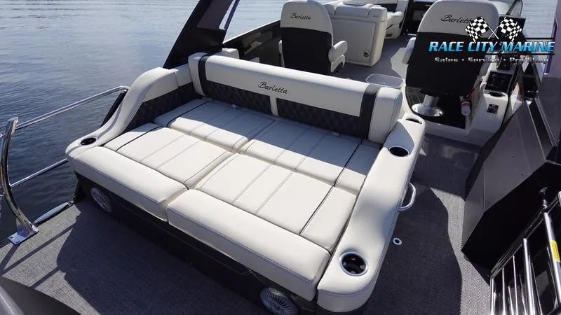 Slide: The Image of 2025 Barletta L25UCAT luxury pontoon boat interior with plush seating. - 17
