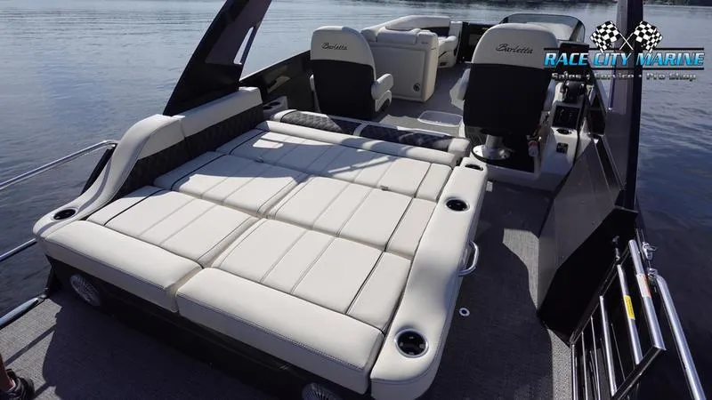 Slide: The Image of 2025 Barletta L25UCAT pontoon boat with spacious seating and modern design on the water. - 19