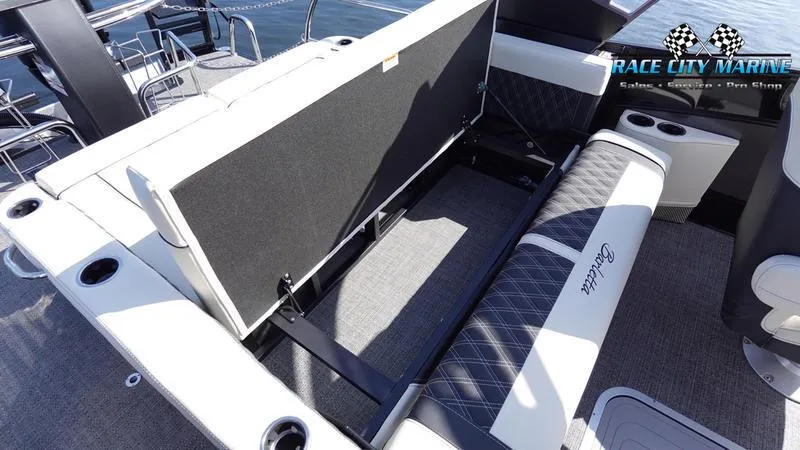 Slide: The Image of 2025 Barletta L25UCAT boat interior with adjustable seating and cup holders. - 22