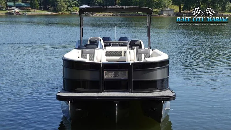 Slide: The Image of 2025 Barletta L25UCAT pontoon boat on a serene lake. - 3