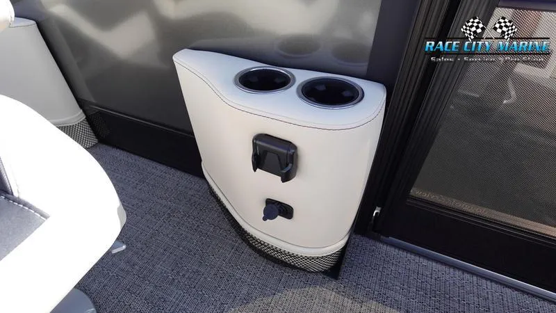 Slide: The Image of 2025 Barletta L25UCAT boat interior with cup holders and charging ports. - 38