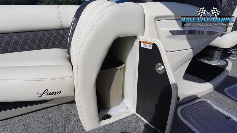 Slide: The Image of Barletta L25UCAT 2025 boat interior with storage compartment and luxurious seating. - 42