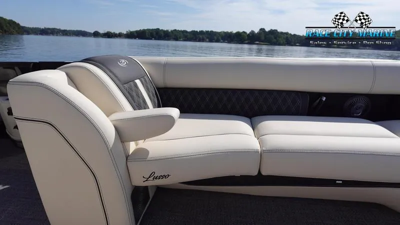Slide: The Image of Barletta L25UCAT 2025 luxury boat seating on a serene lake. - 44