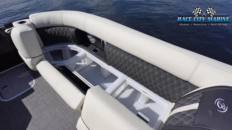 Slide: The Image of 2025 Barletta L25UCAT boat interior with luxurious seating and storage on the water. - 45