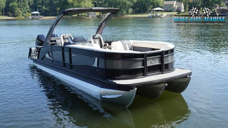 Slide: The Image of 2025 Barletta L25UCAT pontoon boat on a serene lake. - 5