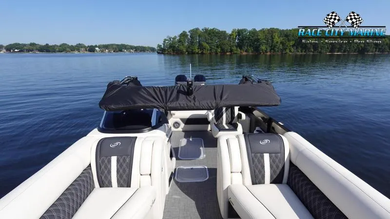 Slide: The Image of 2025 Barletta L25UCAT pontoon boat on a serene lake. - 9
