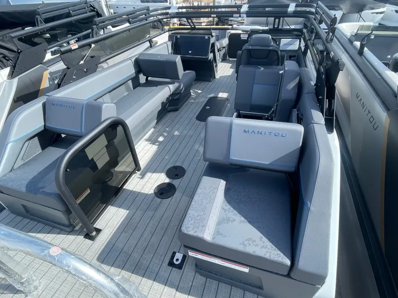 Slide: The Image of 2024 Manitou 22 Explore Switchback HSP575 pontoon boat interior with spacious seating. - 5