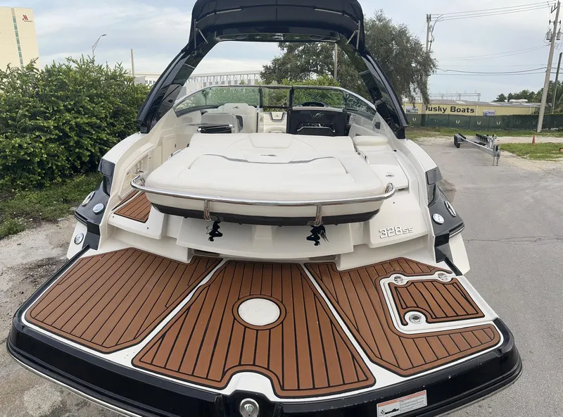 Slide: The Image of 2014 Monterey 328 Super Sport boat with teak deck, rear view. - 4