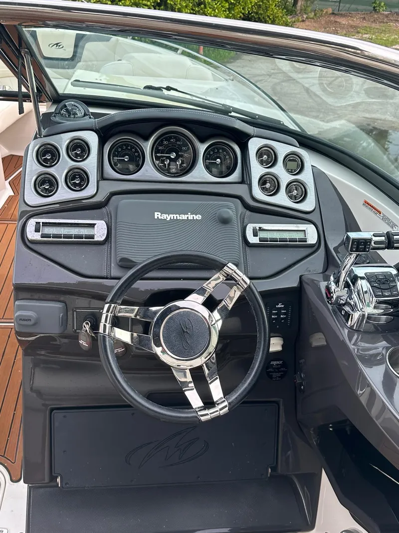 Slide: The Image of Dashboard of 2014 Monterey 328 Super Sport boat with Raymarine navigation system. - 9
