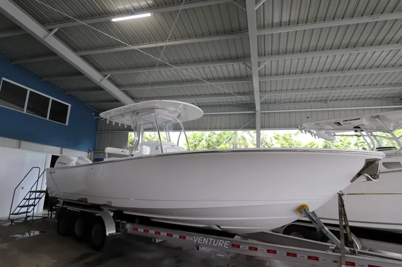 Slide: The Image of 2025 Valhalla Boatworks V-29 Hybrid on trailer in covered storage area. - 10