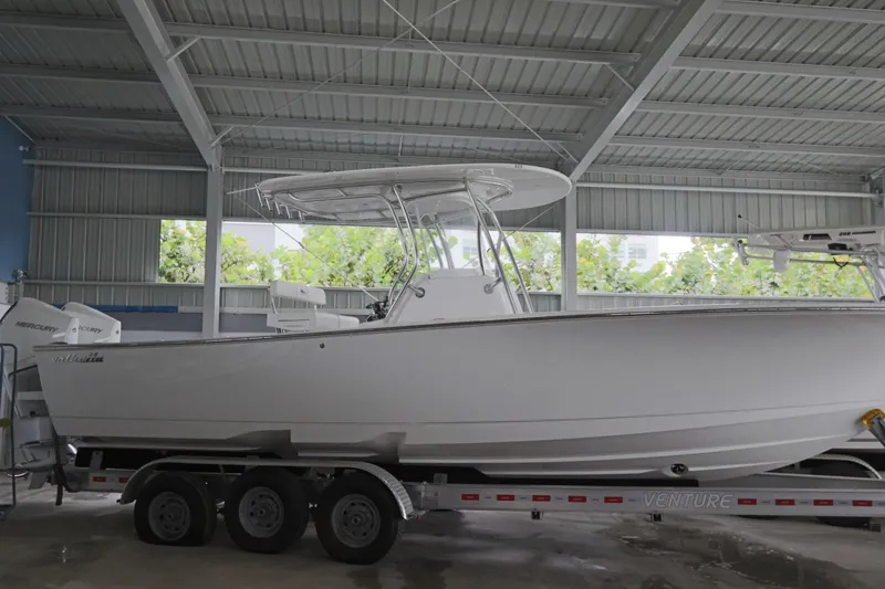 Slide: The Image of 2025 Valhalla Boatworks V-29 Hybrid on trailer in covered storage area. - 11