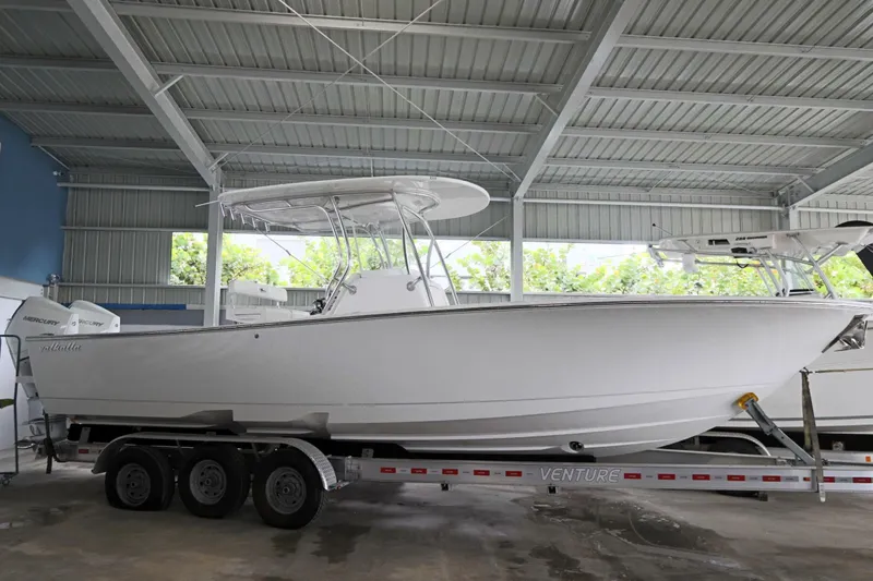 Slide: The Image of 2025 Valhalla Boatworks V-29 Hybrid on trailer in covered storage area. - 12