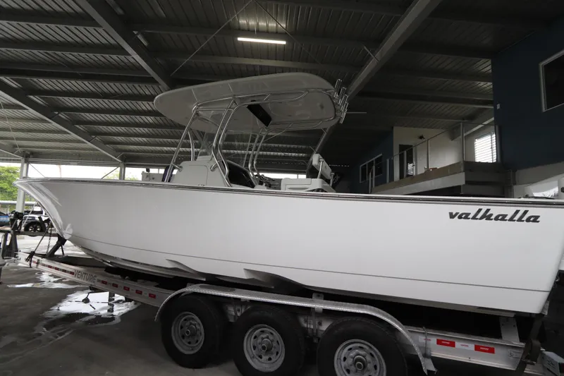 Slide: The Image of 2025 Valhalla Boatworks V-29 Hybrid on trailer in covered storage area. - 14