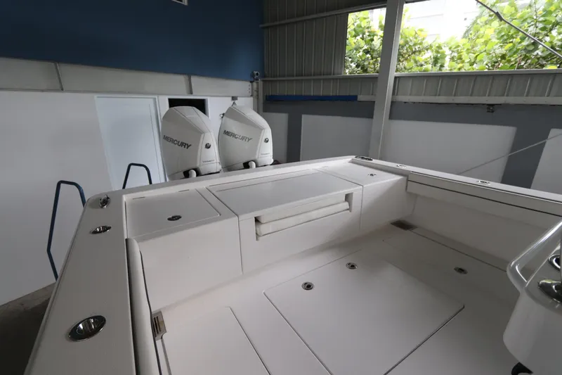 Slide: The Image of 2025 Valhalla Boatworks V-29 Hybrid with dual Mercury engines in a covered storage area. - 16