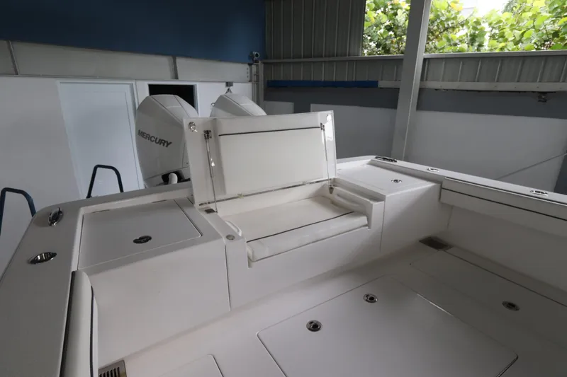 Slide: The Image of 2025 Valhalla Boatworks V-29 Hybrid interior with Mercury engines, featuring seating and storage. - 17