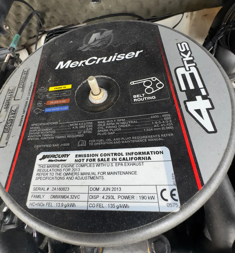 Slide: The Image of MerCruiser 4.3 TKS engine cover with specifications and emission control information. - 11
