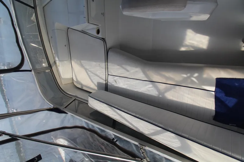 Slide: The Image of 1995 Carver 370 Voyager interior with white seating and blue accents. - 10