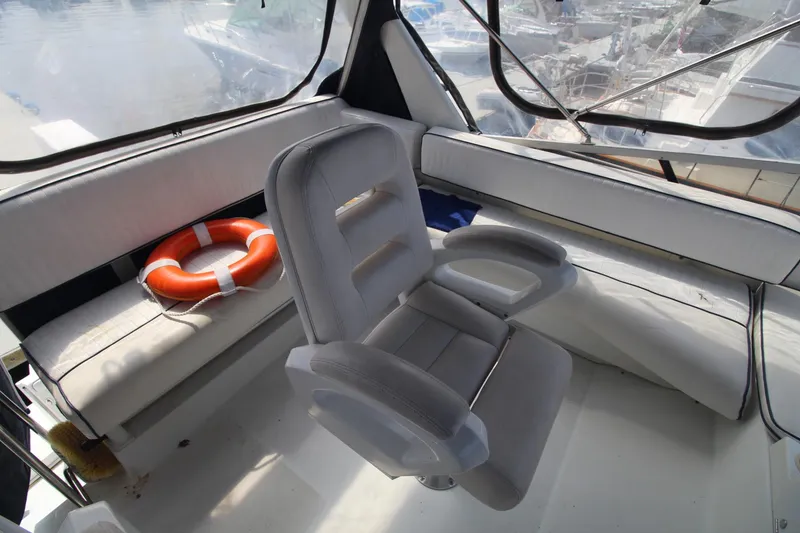 Slide: The Image of Interior of 1995 Carver 370 Voyager with seating and life preserver. - 12